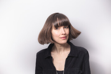 Fototapeta premium Beautiful woman with short bob hairstyle, natural and inviting 