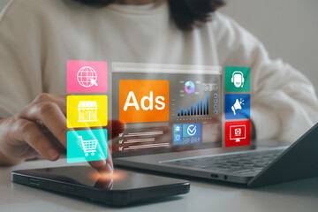 Digital advertising concept. Woman using mobile phone and laptop. Online ads, data analytics dashboard, ecommerce business growth strategy. Modern technology for online campaign performance tracking.