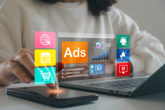 Digital advertising concept. Woman using mobile phone and laptop. Online ads, data analytics dashboard, ecommerce business growth strategy. Modern technology for online campaign performance tracking. - Powered by Adobe