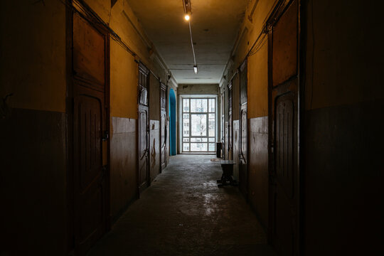 Dark corridor of old shabby dorm or apartment house