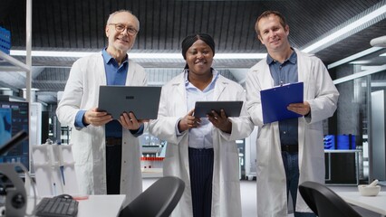 Portrait of three scientists team in biolab conducting a research study, reflecting diagnostics with biochemistry and molecular science. Healthcare innovation for medicine.