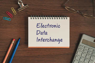There is notebook with the word Electronic Data Interchange. It is as an eye-catching image.