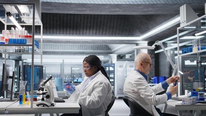 African american researcher examining Petri dish in a biolab. Observation of matter, microorganisms and cellular growth reflects experimental science and pathology investigation.