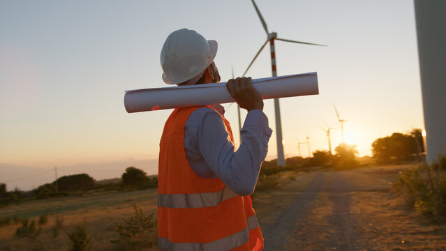Environmental Worker With Helmet And Map 