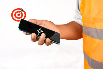  A worker's hand holds a smartphone with a voice message icon, representing voice communication, audio messaging, and digital interaction.
