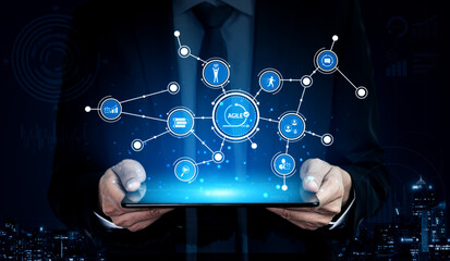 A business professional showcases digital innovation concepts using a tablet, surrounded by technology icons, symbolizing progress and connectivity in a modern city. Tessel
