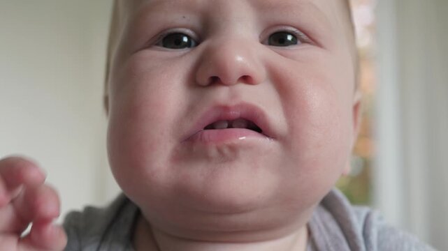Infant distress, Natural facial reactions captured in infants showing signs of discomfort, baby face displaying genuine expressions of unease and distress