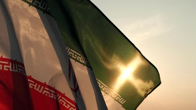 Iran national flag waving with sunlight through fabric texture, expressing national identity, patriotism, culture, and political background for global editorial design.