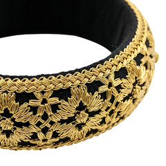 Elegant black and gold embroidered headband with floral design