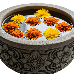 Vibrant flowers floating in a decorative stone bowl