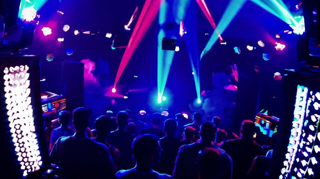 High-angle video of a vibrant nightclub scene with colorful laser lights and a crowd dancing, capturing the energetic party atmosphere.