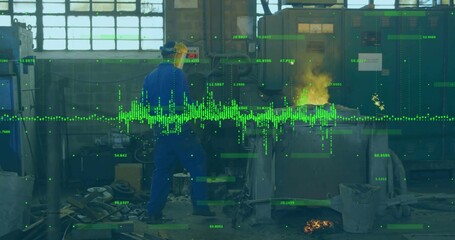 Watching worker in blue coveralls and yellow face shield tending molten forge at shop, data overlay