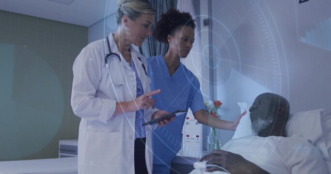 Pointing doctor in coat and stethoscope, nurse in scrubs comforting patient on bed, with tablet HUD - Powered by Adobe