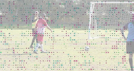 Walking red jersey player moving toward soccer ball on field, wearing yellow bib, goal, copy space