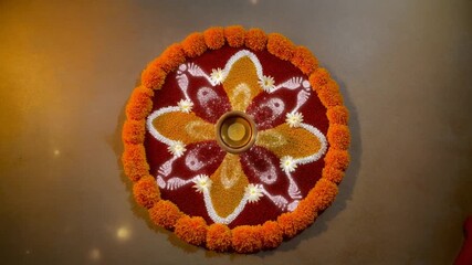 Meticulously crafted traditional rangoli art, featuring vibrant marigold petals and colorful powders, symbolizing devotion and festive spirit for Krishna Janmashtami