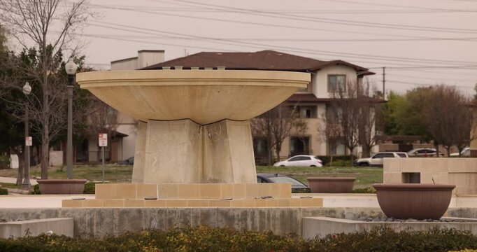 A fountain stands in the center of a road roundabout in Chino, California, USA.