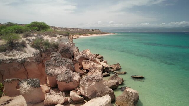 Serene aerial view of Araya Playa la Paria's rocky coastline and blue waters