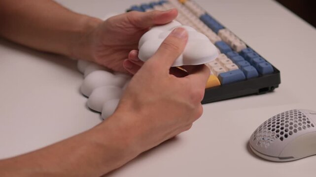 Keyboard setup showcase, Ergonomic mechanical keyboard display, Closeup of tactile switches on custom keyboard, Designer testing pastel keycaps with ergonomic wrist cushion setup