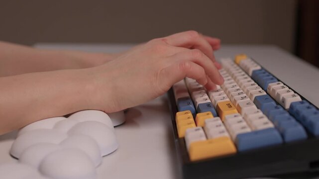 Keyboard setup showcase, Ergonomic mechanical keyboard display, Closeup of tactile switches on custom keyboard, Designer testing pastel keycaps with ergonomic wrist cushion setup