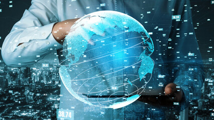 A businessman interacts with a smartphone while a digital globe and data analytics appear over a modern city backdrop, symbolizing global connectivity and insight. Xenic
