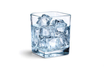 Clear glass filled with ice cubes on a plain surface