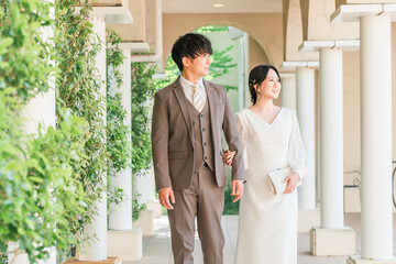 Wedding reception, after-party, bride and groom appearing in wedding dresses, dressed-up couple,...