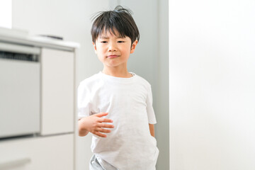 A boy running around his home (childcare, parenting, energy)