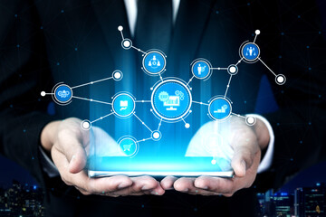 A businessman presents a smartphone displaying a vibrant digital interface, symbolizing the integration of technology and data in today fast-paced business landscape. Tessel