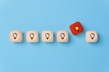 Innovation, creative or new idea concept using wood blocks with light bulb