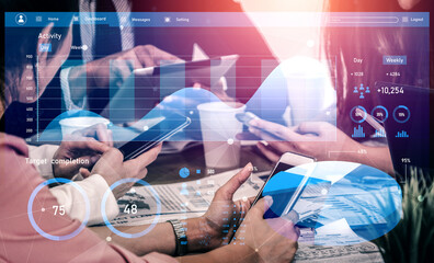 This image showcases a collaborative business meeting where individuals engage with mobile devices and digital analytics on a screen, emphasizing teamwork and innovation. Impute