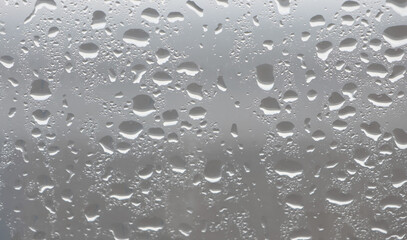 PNG Raindrops on glass surface background droplets texture.