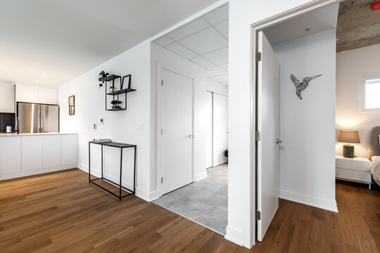 High-quality photo set of a contemporary urban apartment highlighting modern architecture, minimalist interior design, and functional living spaces. The series includes exterior facade, building entra