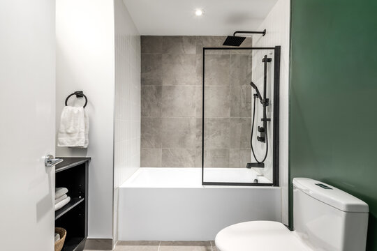 High-quality photo set of a contemporary urban apartment highlighting modern architecture, minimalist interior design, and functional living spaces. The series includes exterior facade, building entra
