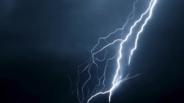 Intense lightning bolt striking through dark storm clouds. A powerful display of nature's electricity and thunder weather for cinematic effects.