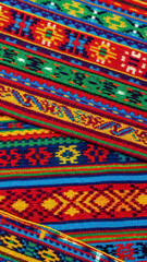 Colorful Traditional Woven Fabric with Geometric Patterns and Vibrant Stripes