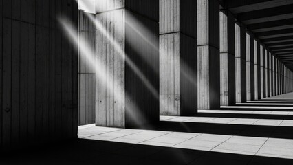 Sunlight streams through columns in a modern architectural corridor with dramatic shadows and light beams