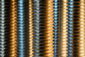 Rows of Threaded Steel Bolts Background