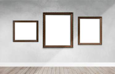Wooden picture frame mockups hanging on a gray wall