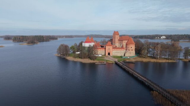 Trakai Island Castle Traku Pilis In Lithuania Bridge Approach Trakai Island Castle Walkway Over Water Historic Gateway Pilgrimage Vibe Reenactor Scene Journey Shot For Travel Story