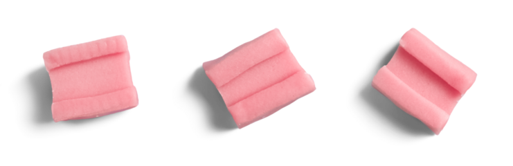 Isolated pink chewing gum pieces