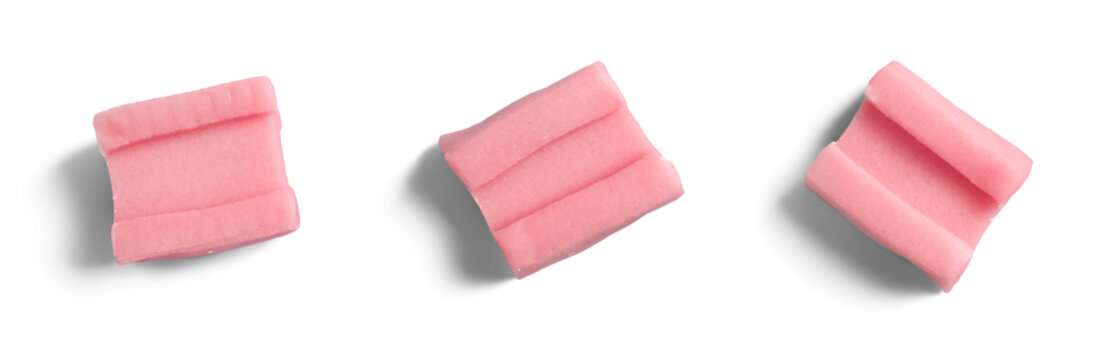 Isolated pink chewing gum pieces