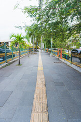 Guiding Block or guide path to help people with sensory disabilities (blind) to walk safely and in a directed manner by utilizing the texture of the tiles