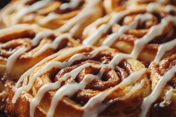 Close Up Golden Cinnamon Rolls With White Icing Drizzle On Dark Background pastries baked