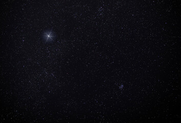 Dark sky with the Christmas star shining brightest among all lights © Guy Sagi