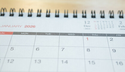January 2026 calendar page on wooden desk for planning and new year goals