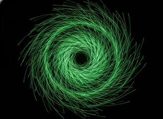 Fototapeta premium Vibrant green swirling light pattern on black background