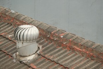 Weathered Roof Turbine Vent on Residential Building