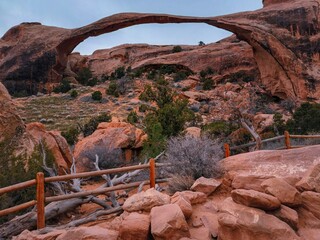A large archway is seen in the distance, with a fence in front of it © ExploringandLiving