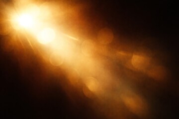 Golden light shining bright in dark space