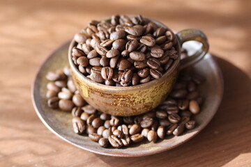Fototapeta premium coffee beans in a cup